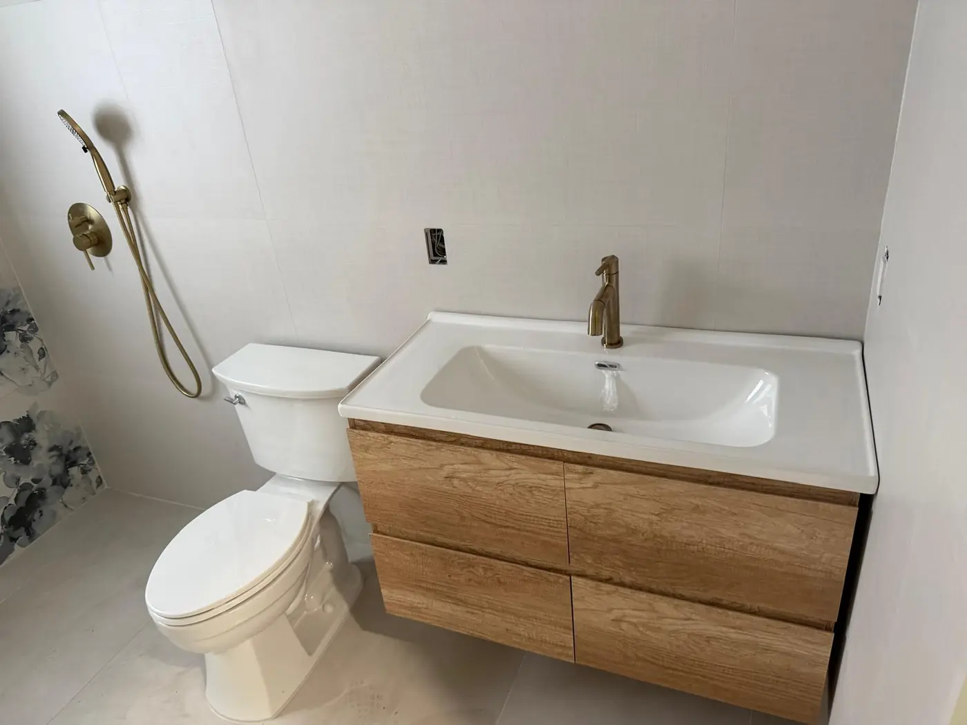 Finished bathroom remodel with new vanity, faucet and toilet installed