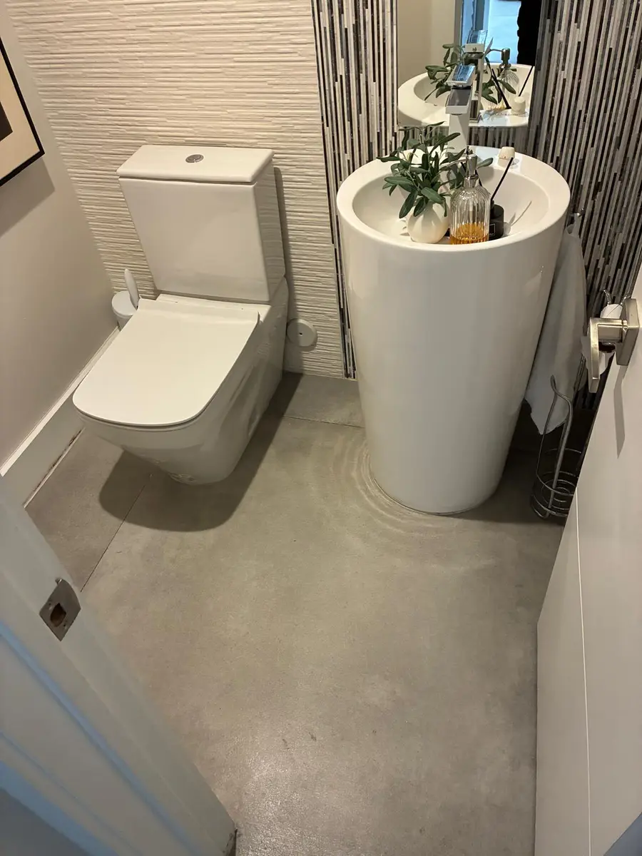 Modern finished bathroom with floating basin and toilet