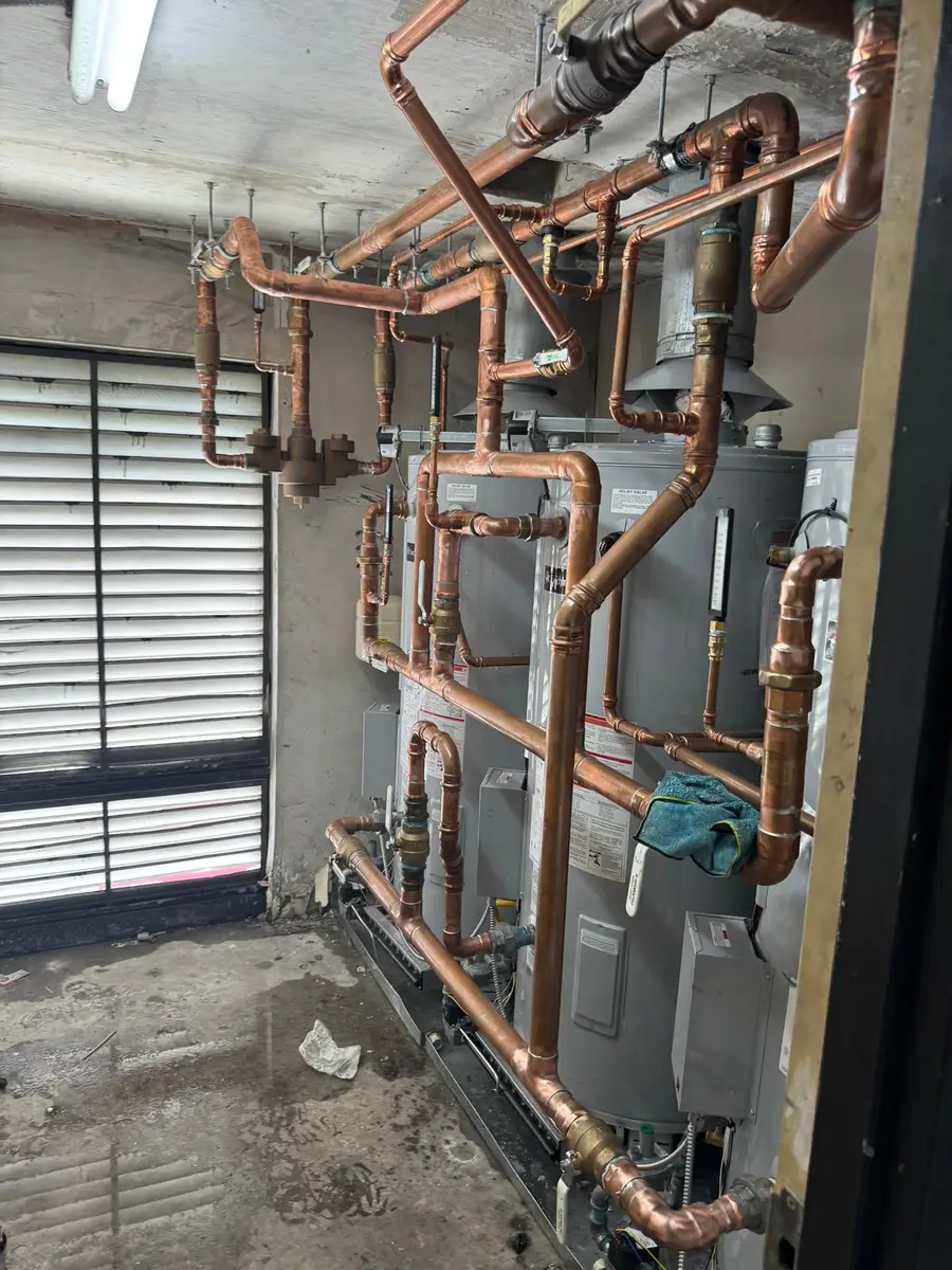 Copper piping and water heaters in a commercial plant room