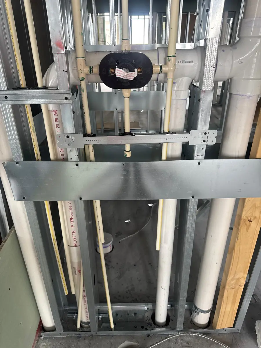 Plumbing risers and stacks installed in a multi-story building